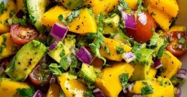 Fresh Avocado and Mango Salad with vibrant ingredients and dressing.
