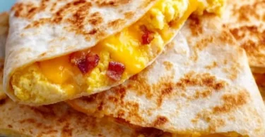 Delicious breakfast quesadilla filled with eggs, cheese, and vegetables