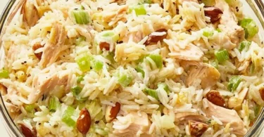 Healthy Chicken Rice Salad with fresh vegetables and dressing