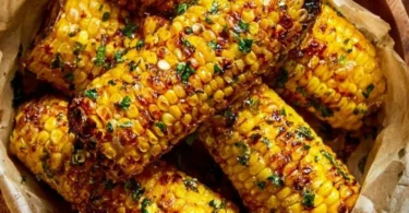 Delicious Cowboy Butter Roasted Corn served on a plate