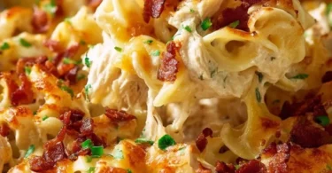 A delicious Crazy Good Casserole served in a baking dish with fresh herbs