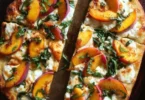 Easy Peach Basil Naan Pizza topped with fresh basil and juicy peaches
