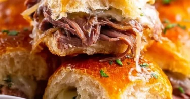 French Dip Sliders served on a platter with dipping sauce