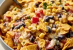 Colorful Frito Corn Salad with corn, peppers, and Fritos in a bowl