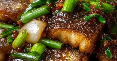 Delicious Ginger Onion Fried Sea Bass served on a plate