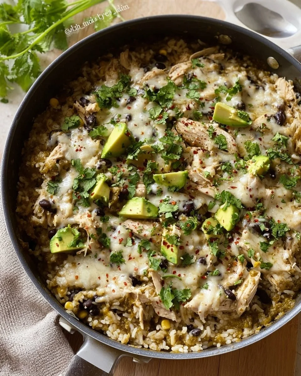Delicious green sauce chicken served with rice in a skillet dish