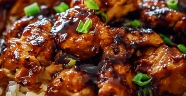 Delicious honey BBQ chicken rice bowl with vegetables and sauce