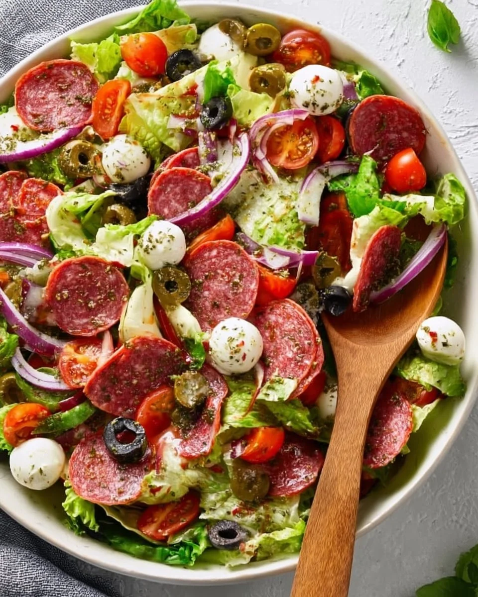 Colorful Italian salad with fresh vegetables and herbs in a bowl.